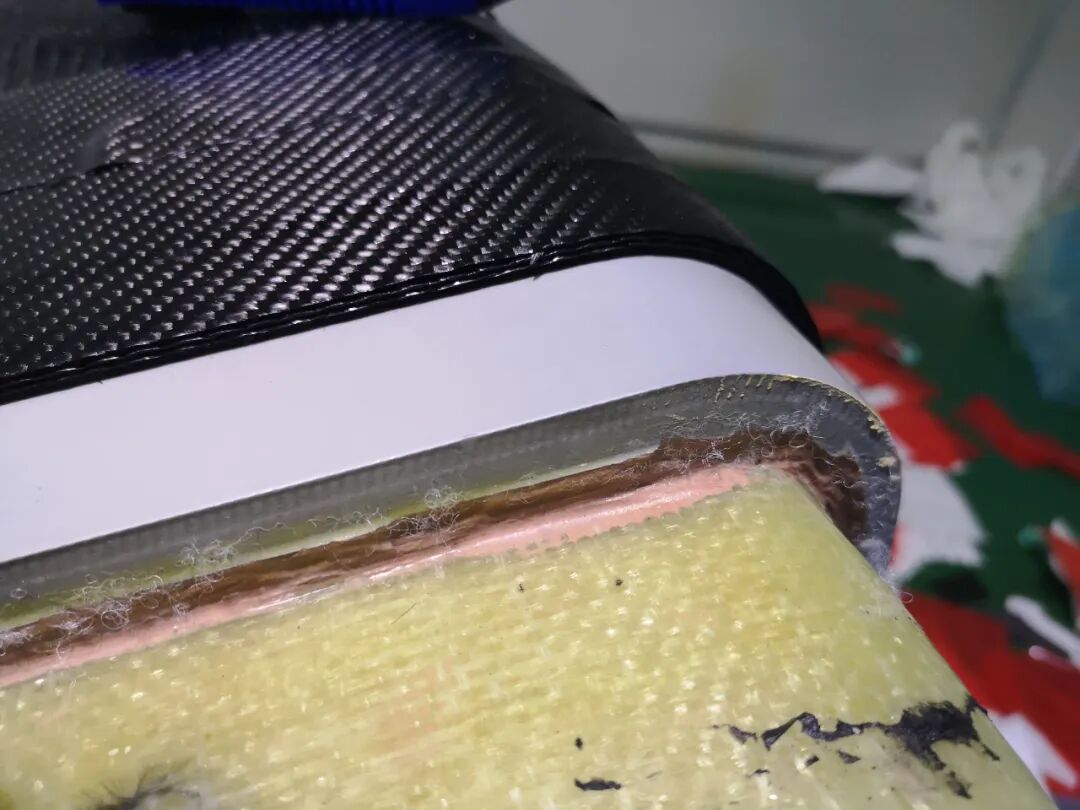Carbon-fibre laminate laid over a shaped master
